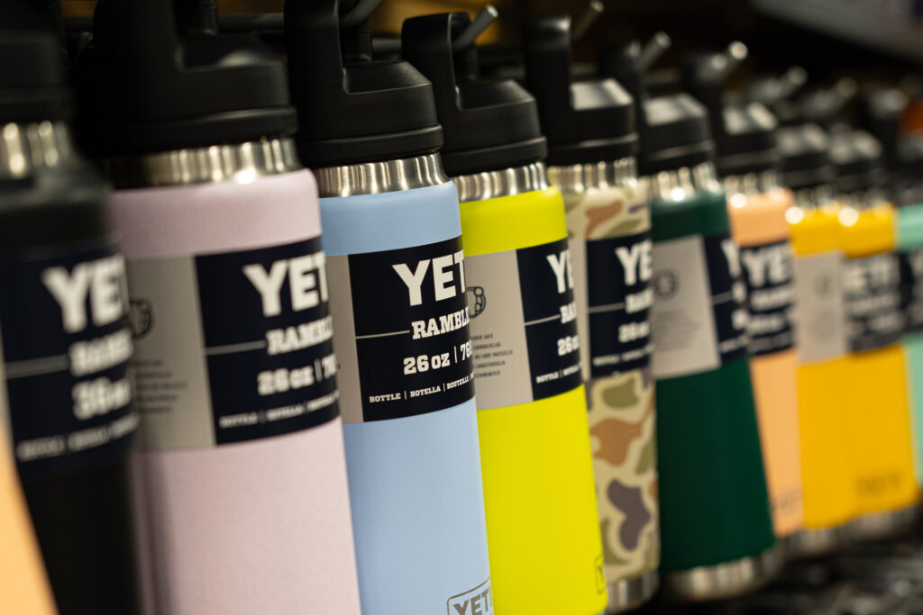 Yeti water bottles hanging in a row