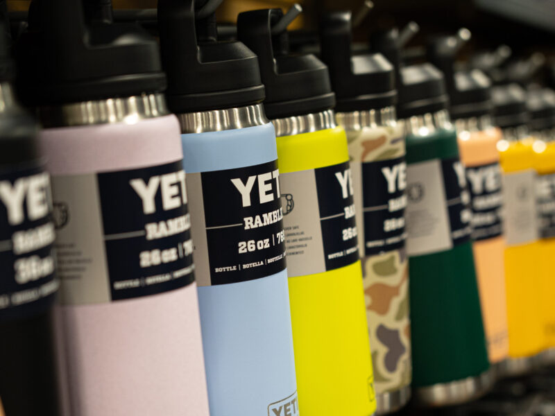 Yeti water bottles hanging in a row
